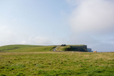 Scenic view of irish countryside against sky in the morning