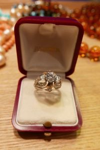 Close-up of wedding rings on table