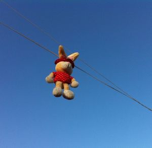 Low angle view of tree against blue sky