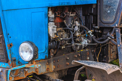 Opened diesel engine compartment of old belarussian farm tractor