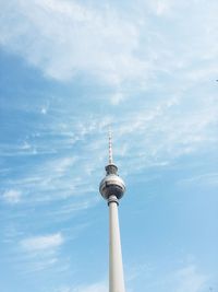 Low angle view of communications tower against sky