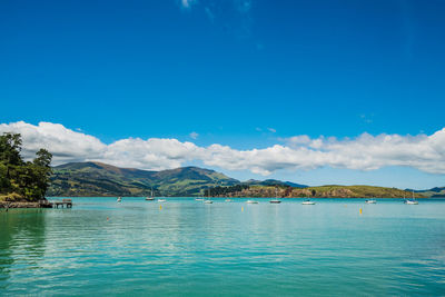 Scenic view of sea against blue sky