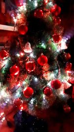 Close-up of christmas tree at night