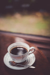 Close-up of coffee cup on table