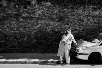Couple hugging outdoors