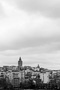 View of buildings and galata töre against cloudy sky