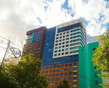 Low angle view of building against cloudy sky