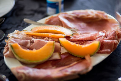 Close-up of meat served in plate on table