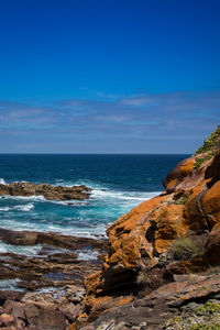 Scenic view of sea against blue sky