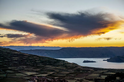 Scenic view of landscape against sky during sunset