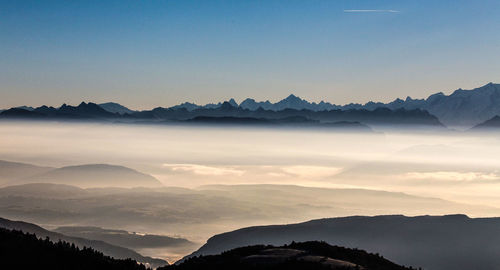 Scenic view of silhouette mountains against sky during sunset