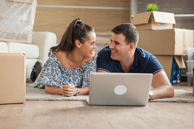 Young woman using laptop at home