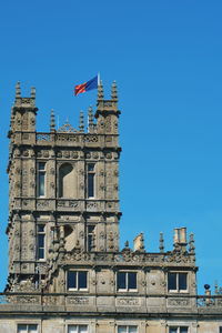 Low angle view of building against blue sky