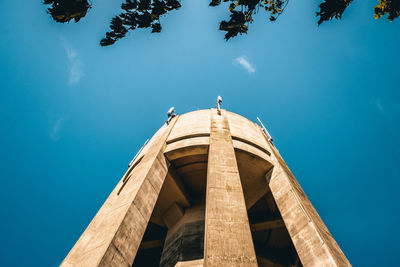 Low angle view of built structure against blue sky