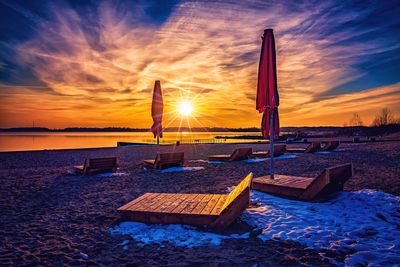 Scenic view of beach against sky during sunset