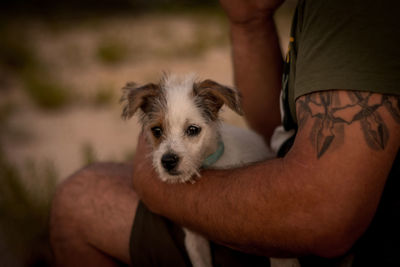 Midsection of man with dog