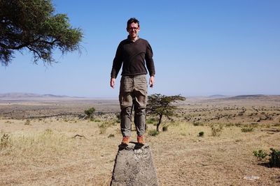 Rear view of man standing on beach