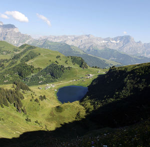 Scenic view of landscape and mountains against sky