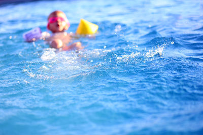 Water with child swimming in background