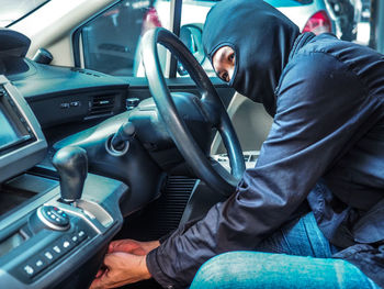 Man sitting in car
