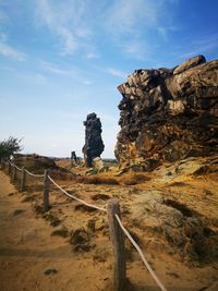 Rock formations on land against sky