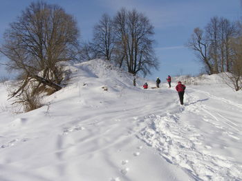People on snow covered hill
