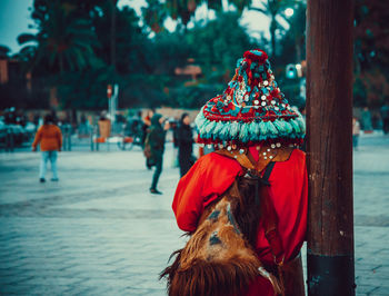 Rear view of woman with umbrella