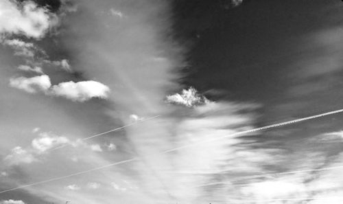 Low angle view of vapor trails in sky