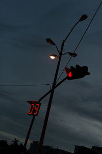 Low angle view of street light against sky