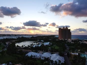 High angle view of buildings against cloudy sky