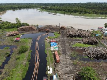 High angle view of people on river amidst trees