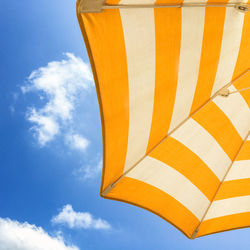 Low angle view of umbrella against sky