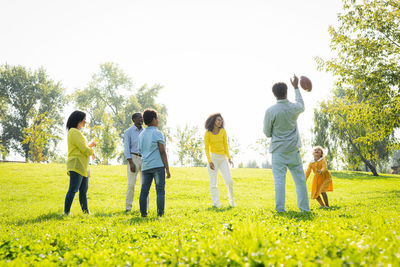 People on grassy field