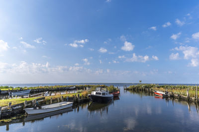 Boats moored at harbor