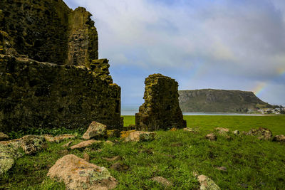 Built structure on land against sky