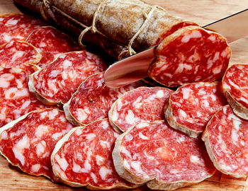 Sliced fresh salami, a traditional dried and cured italian sausage prepared from meat