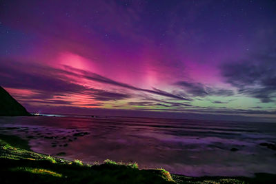 Scenic view of sea against sky at night