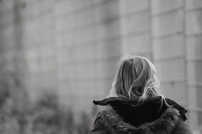 Rear view of girl in warm clothes