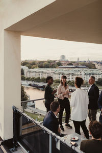 Female and male colleagues during office party