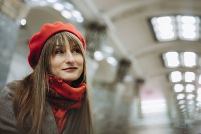 Portrait of young woman in city