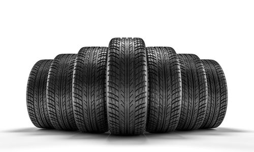Close-up of tires against white background