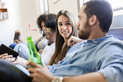 Friends socializing on the sofa