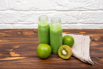 Close-up of green fruits on table