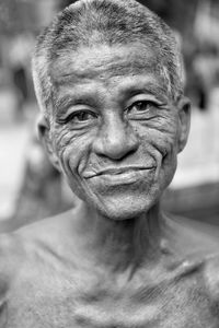 Close-up portrait of smiling senior man 