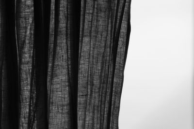 Close-up of curtain against clear sky