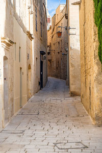 Narrow alley along buildings