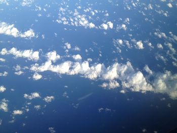 Aerial view of landscape against blue sky