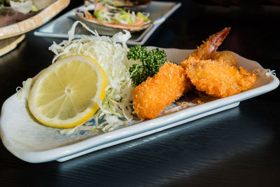 High angle view of fruits in plate on table