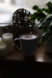 Close-up of coffee cup on table