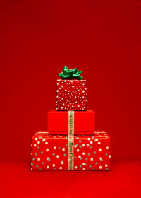 Close-up of christmas presents against yellow background